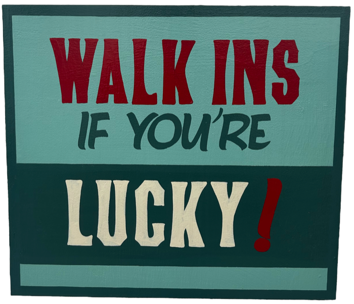 Hand-painted shop sign reading: Walk ins, if you're lucky!